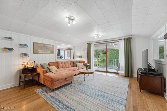 4324 Ormond Dr, New Franklin, OH 44319 - living room with light wood-style flooring, vaulted ceiling, and a decorative wall