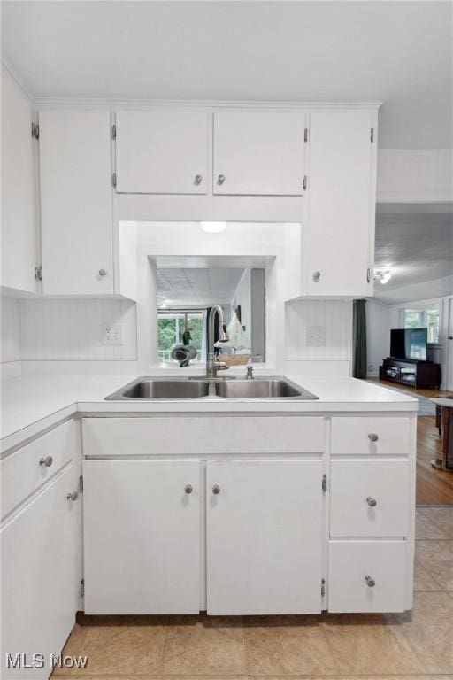 4324 Ormond Dr, New Franklin, OH 44319 - kitchen with white cabinets, light countertops, and light tile patterned flooring