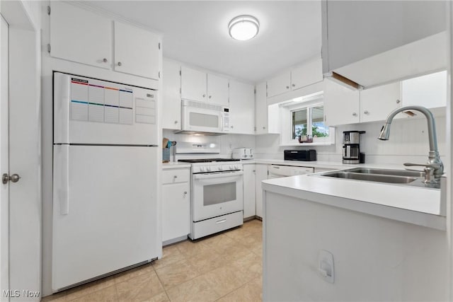 4324 Ormond Dr, New Franklin, OH 44319 - kitchen with white appliances, light countertops, white cabinetry, and tasteful backsplash