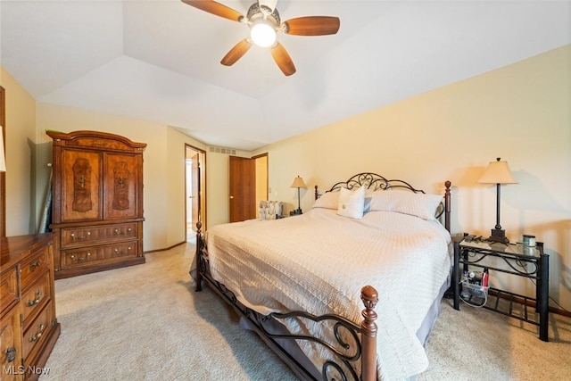 7700 Sparrow Flight Dr, Seven Hills, OH 44131 - bedroom featuring light colored carpet, a tray ceiling, and a ceiling fan
