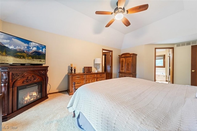 7700 Sparrow Flight Dr, Seven Hills, OH 44131 - bedroom with carpet flooring, vaulted ceiling, a glass covered fireplace, and ceiling fan