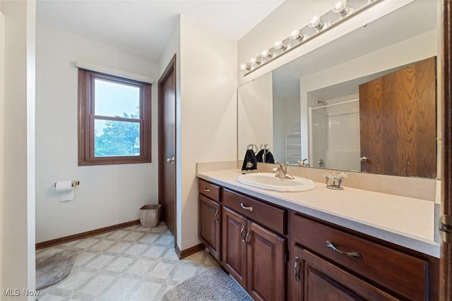 7700 Sparrow Flight Dr, Seven Hills, OH 44131 - bathroom featuring vanity, a shower, and tile patterned floors