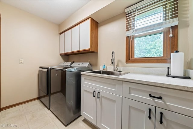 7700 Sparrow Flight Dr, Seven Hills, OH 44131 - laundry area with washing machine and clothes dryer and cabinet space