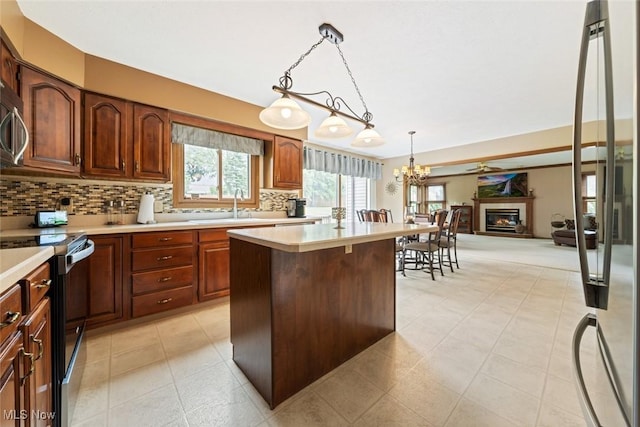 7700 Sparrow Flight Dr, Seven Hills, OH 44131 - kitchen featuring stainless steel appliances, light countertops, and healthy amount of natural light