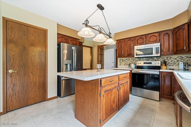 7700 Sparrow Flight Dr, Seven Hills, OH 44131 - kitchen with stainless steel appliances, a kitchen island, light countertops, and backsplash