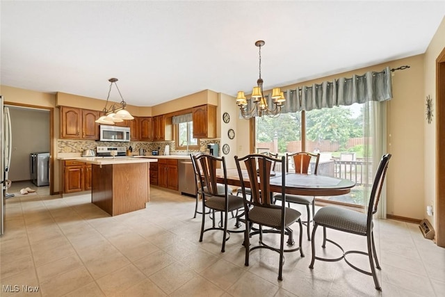 7700 Sparrow Flight Dr, Seven Hills, OH 44131 - dining room with a chandelier and baseboards