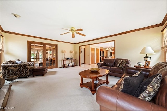 7700 Sparrow Flight Dr, Seven Hills, OH 44131 - carpeted living room with french doors, a chandelier, a ceiling fan, and ornamental molding