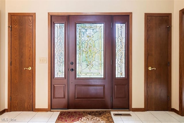 7700 Sparrow Flight Dr, Seven Hills, OH 44131 - entrance foyer with baseboards and light tile patterned floors