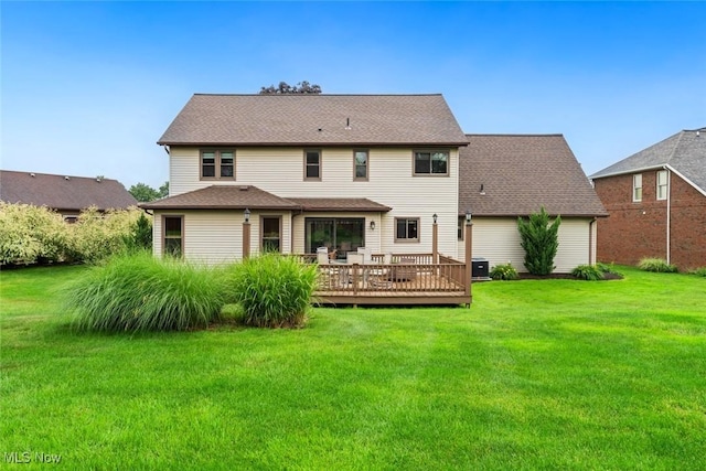 7700 Sparrow Flight Dr, Seven Hills, OH 44131 - rear view of property with a yard and a wooden deck
