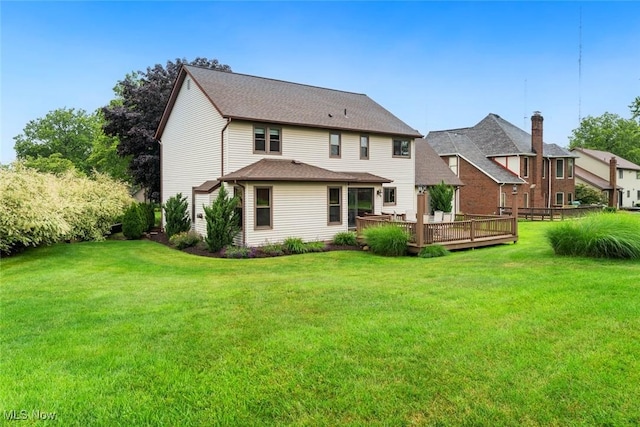 7700 Sparrow Flight Dr, Seven Hills, OH 44131 - back of property with a lawn and a deck