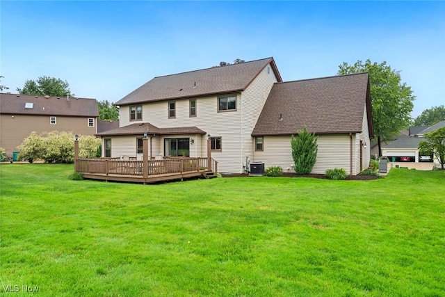 7700 Sparrow Flight Dr, Seven Hills, OH 44131 - rear view of house featuring a deck, a lawn, and a shingled roof