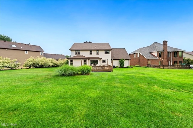 7700 Sparrow Flight Dr, Seven Hills, OH 44131 - rear view of property featuring a wooden deck and a lawn