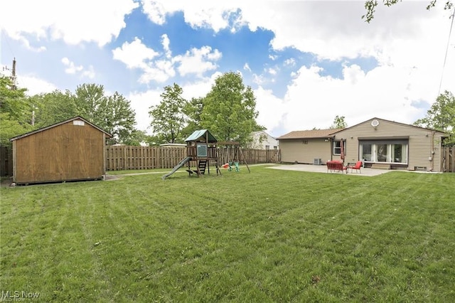 4938 N Sedgewick Rd, Lyndhurst, OH 44124 - fenced backyard featuring a storage shed, a patio, and a playground