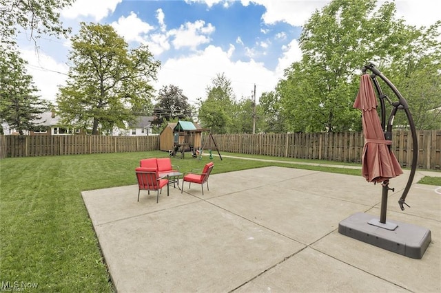 4938 N Sedgewick Rd, Lyndhurst, OH 44124 - fenced backyard featuring a playground and a patio area