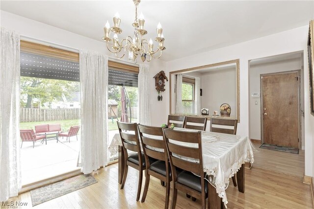 4938 N Sedgewick Rd, Lyndhurst, OH 44124 - dining room featuring a chandelier and light wood finished floors