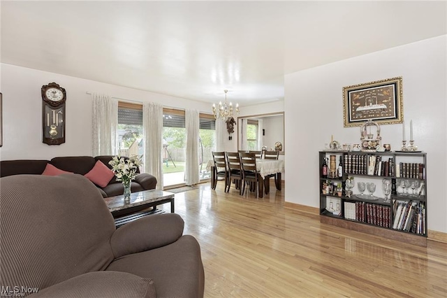 4938 N Sedgewick Rd, Lyndhurst, OH 44124 - living area featuring a chandelier and light wood-style flooring