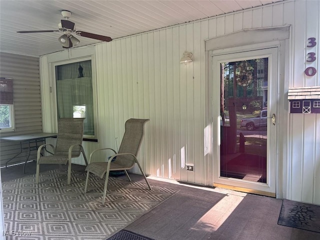 330 E Main St, East Palestine, OH 44413 - doorway to property featuring a ceiling fan, board and batten siding, and a patio