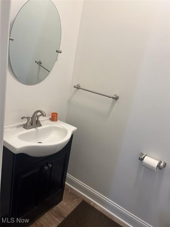 330 E Main St, East Palestine, OH 44413 - bathroom featuring vanity and wood finished floors