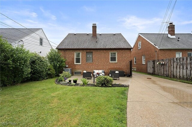 5910 Gerald Ave, Parma, OH 44129 - rear view of property with an outdoor living space, brick siding, a patio area, and roof with shingles