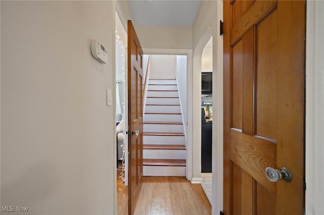 5910 Gerald Ave, Parma, OH 44129 - corridor featuring arched walkways, light wood-type flooring, and stairs