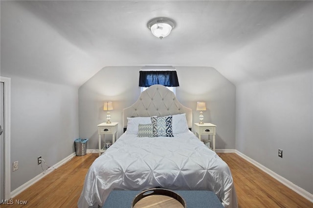 5910 Gerald Ave, Parma, OH 44129 - bedroom featuring wood finished floors and lofted ceiling