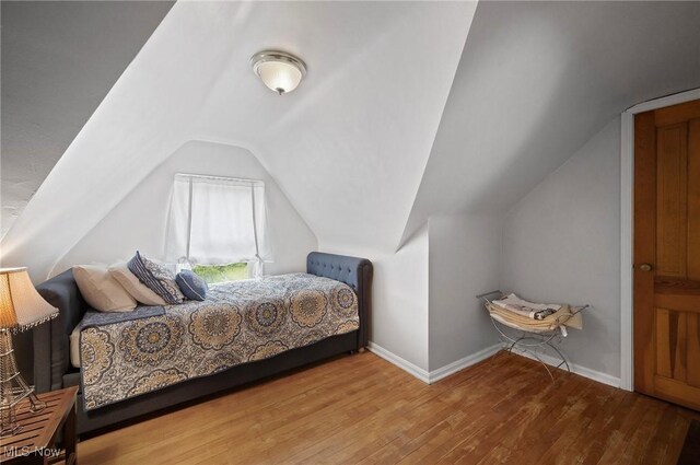 5910 Gerald Ave, Parma, OH 44129 - bedroom featuring wood finished floors and lofted ceiling