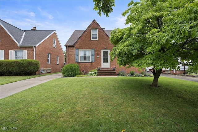 5910 Gerald Ave, Parma, OH 44129 - view of front of property with brick siding and a front lawn