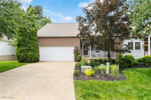 637 N Ridgecliff St, Tallmadge, OH 44278 - obstructed view of property with brick siding, concrete driveway, a front yard, and an attached garage