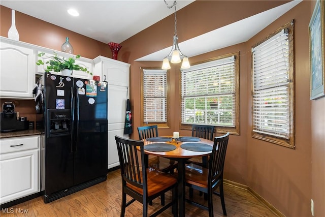 637 N Ridgecliff St, Tallmadge, OH 44278 - dining room featuring light wood-style flooring and baseboards