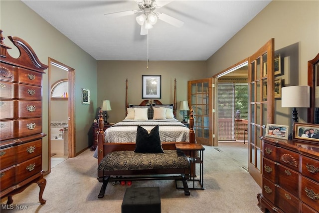 637 N Ridgecliff St, Tallmadge, OH 44278 - bedroom with light carpet, ensuite bath, and access to exterior