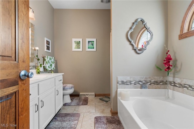 637 N Ridgecliff St, Tallmadge, OH 44278 - bathroom featuring vanity, a bath, and tile patterned floors