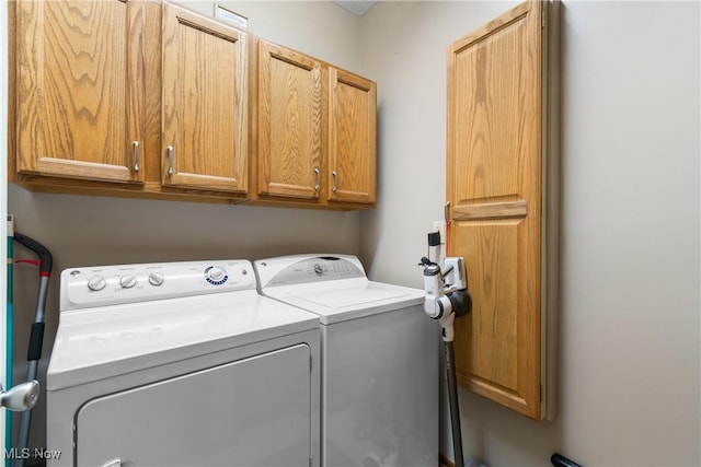 637 N Ridgecliff St, Tallmadge, OH 44278 - washroom featuring washer and dryer and cabinet space