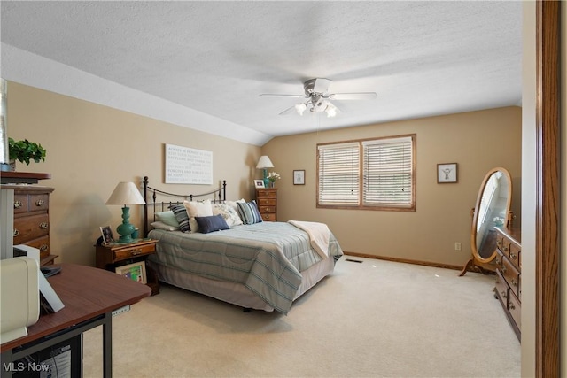 637 N Ridgecliff St, Tallmadge, OH 44278 - bedroom with light colored carpet, ceiling fan, and a textured ceiling