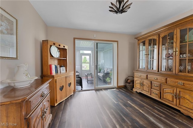 7876 Walnut St Unit B, Boardman, OH 44512 - doorway to outside with dark wood-type flooring and baseboards