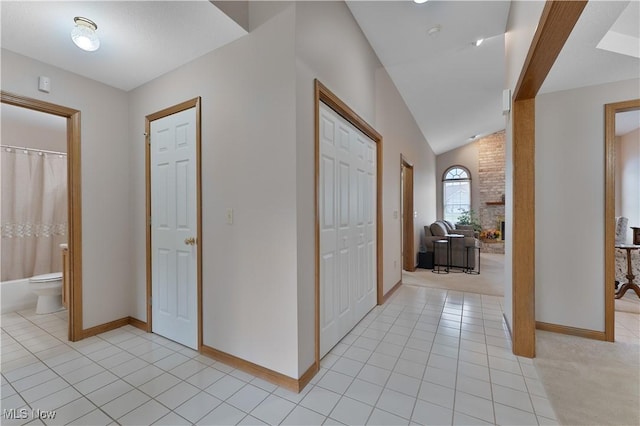 7876 Walnut St Unit B, Boardman, OH 44512 - corridor featuring vaulted ceiling and light tile patterned floors