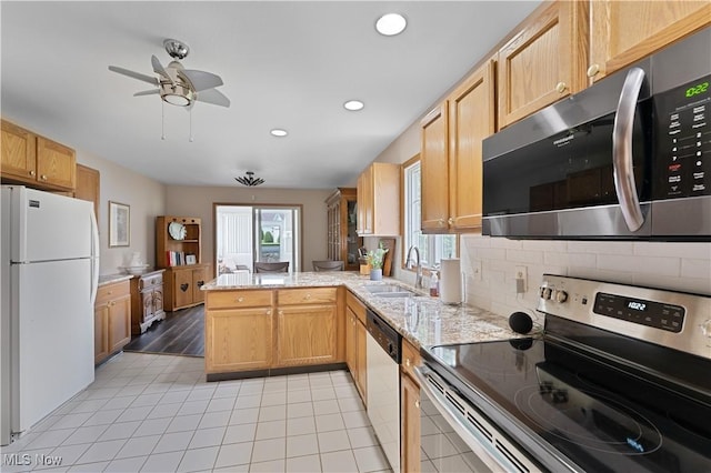7876 Walnut St Unit B, Boardman, OH 44512 - kitchen with appliances with stainless steel finishes, a peninsula, light tile patterned flooring, a ceiling fan, and recessed lighting