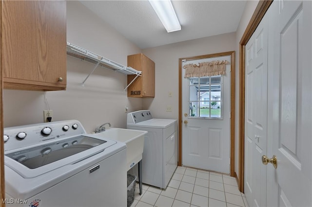7876 Walnut St Unit B, Boardman, OH 44512 - laundry area with cabinet space, washing machine and clothes dryer, and light tile patterned floors