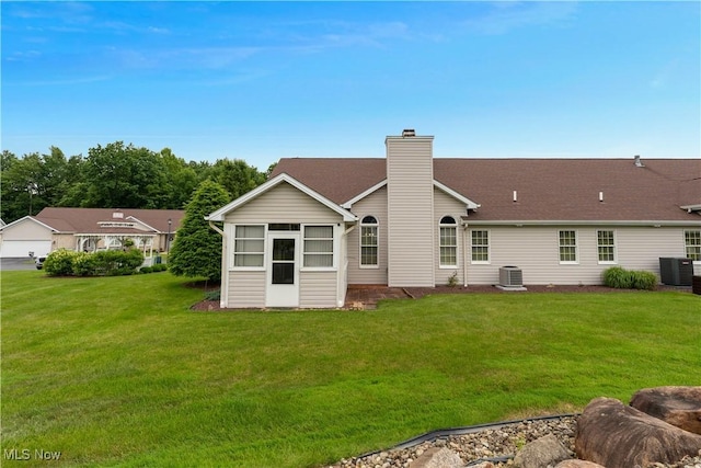 7876 Walnut St Unit B, Boardman, OH 44512 - back of house featuring a yard and a chimney