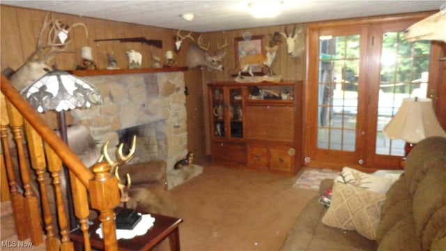 3981 Washington School Rd, New Cumberland, WV 26047 - carpeted living room featuring wooden walls and a fireplace