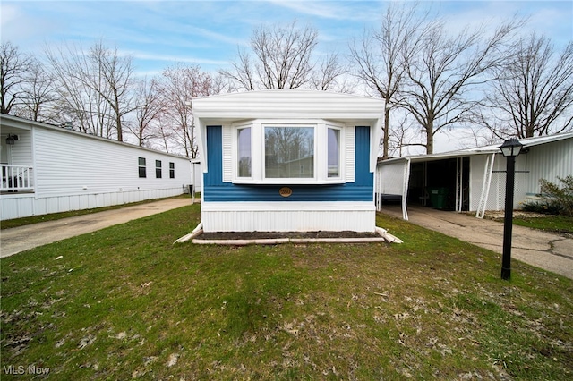 34424 Euclid Ave Unit 260, Willoughby, OH 44094 - view of front of house with a carport and a front lawn
