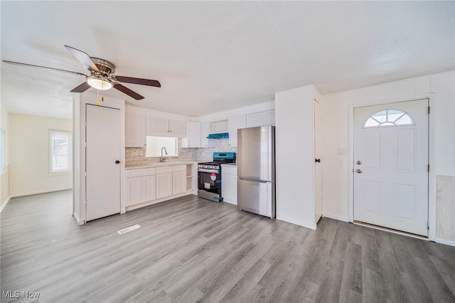 34424 Euclid Ave Unit 260, Willoughby, OH 44094 - kitchen featuring freestanding refrigerator, electric range, light wood-style flooring, ceiling fan, and light countertops