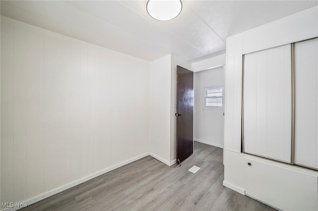 34424 Euclid Ave Unit 260, Willoughby, OH 44094 - unfurnished bedroom featuring wood finished floors and a closet