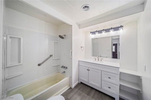 34424 Euclid Ave Unit 260, Willoughby, OH 44094 - bathroom with vanity, wood finished floors, and bathing tub / shower combination