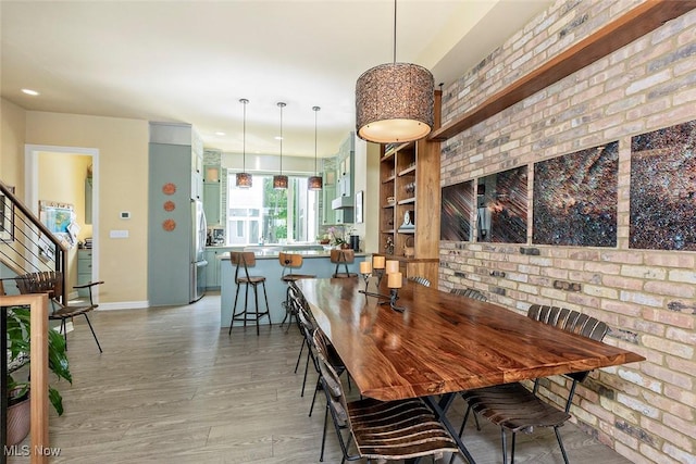 1569 E 118th St Unit B, Cleveland, OH 44106 - dining space featuring light wood finished floors, stairs, and recessed lighting