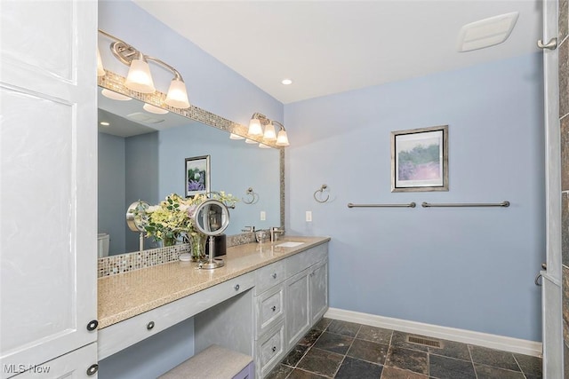 1569 E 118th St Unit B, Cleveland, OH 44106 - bathroom with baseboards and double vanity