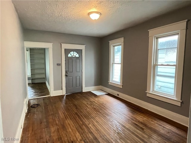 907 Lovers Ln, Akron, OH 44306 - entrance foyer featuring dark wood-style flooring, plenty of natural light, and a textured ceiling