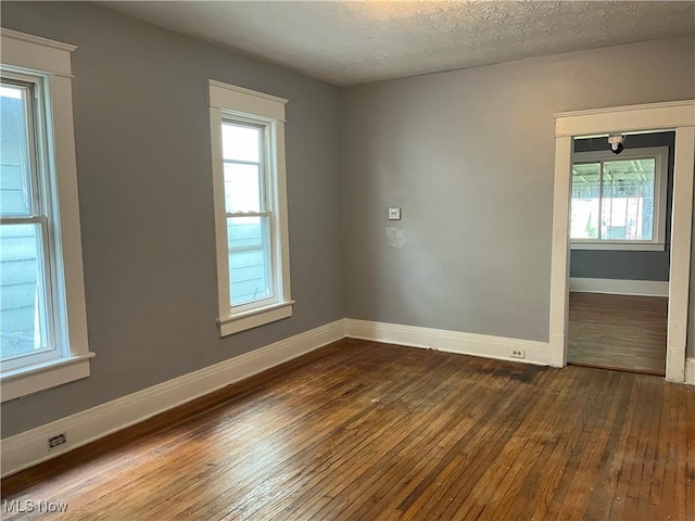 907 Lovers Ln, Akron, OH 44306 - empty room with hardwood / wood-style flooring and baseboards