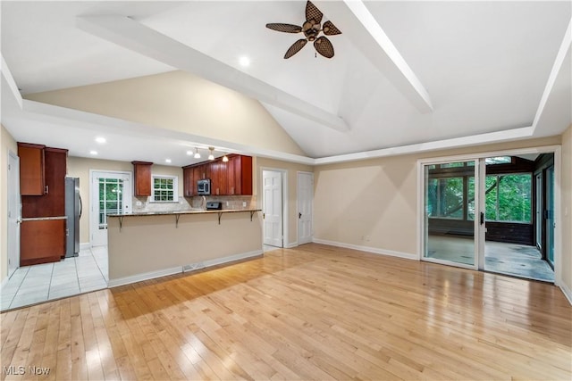 3965 Ellendale Rd, Chagrin Falls, OH 44022 - unfurnished living room featuring a ceiling fan, vaulted ceiling, light wood-style floors, and recessed lighting