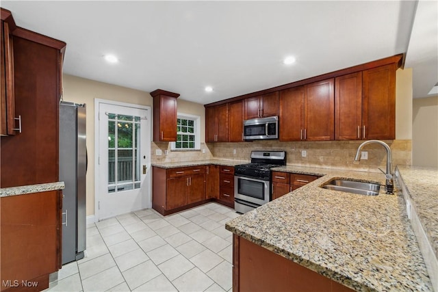 3965 Ellendale Rd, Chagrin Falls, OH 44022 - kitchen with stainless steel appliances, light stone counters, decorative backsplash, light tile patterned floors, and recessed lighting
