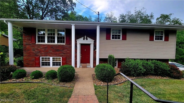 112 Laurel Ln, Washington, WV 26181 - raised ranch with a front yard and brick siding